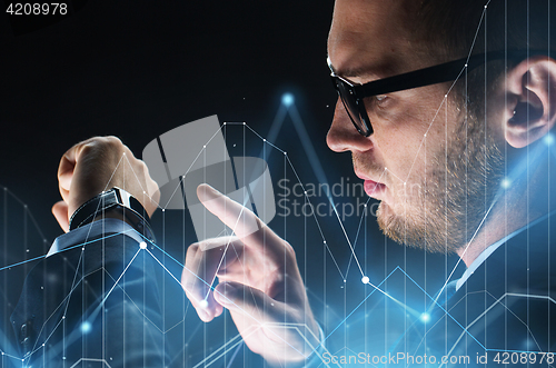 Image of close up of businessman with smartwatch