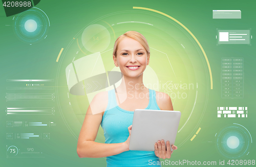 Image of happy smiling sporty woman with tablet pc