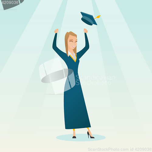 Image of Graduate throwing up graduation hat.