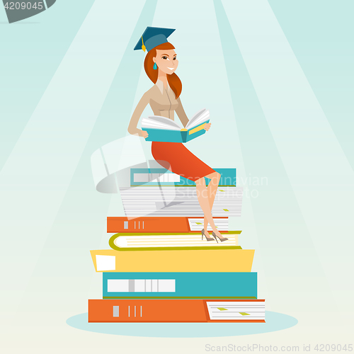 Image of Student sitting on huge pile of books.