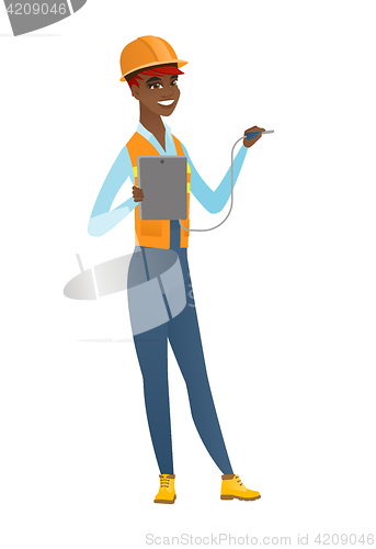 Image of African electrician with electrical equipment.
