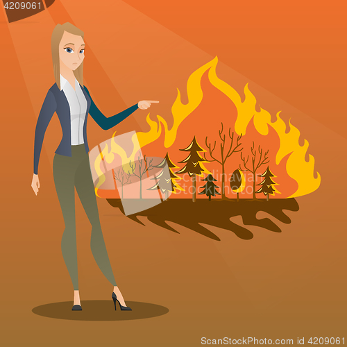 Image of Woman standing on background of wildfire.