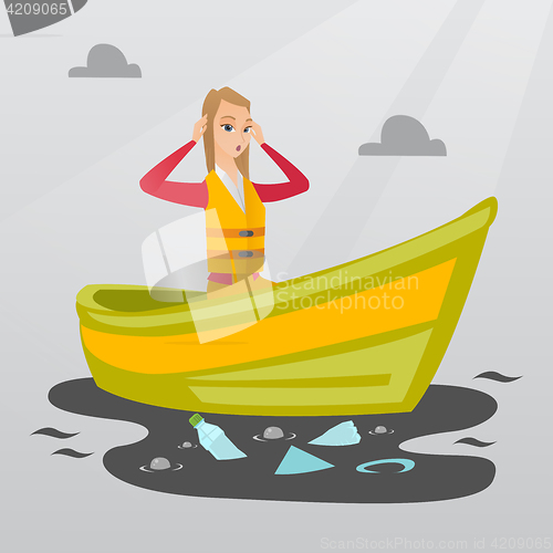 Image of Woman floating in a boat in polluted water.