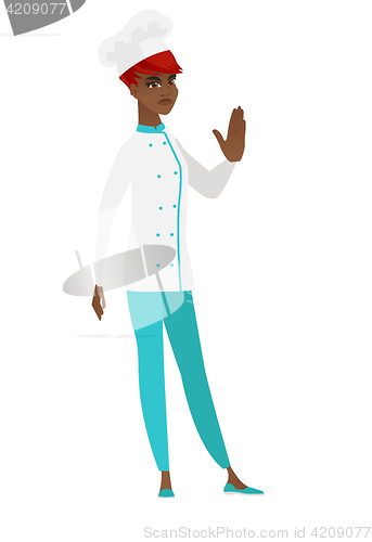 Image of African chef cook showing stop hand gesture.