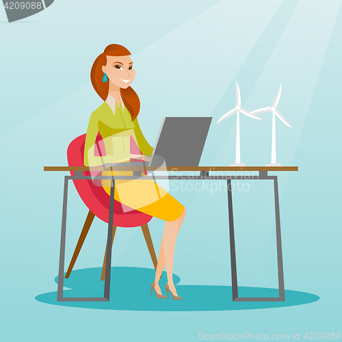 Image of Woman working with model of wind turbines.