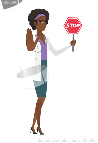 Image of African-american doctor holding stop road sign.