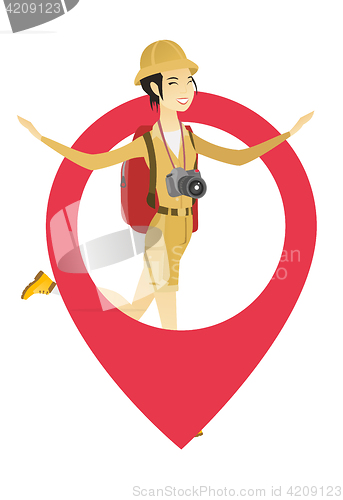 Image of Traveler woman jumping through a big map pointer.