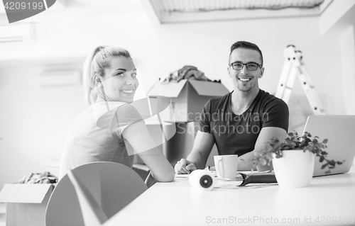 Image of Young couple moving in a new home