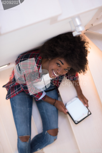 Image of black woman using her electronic tablet