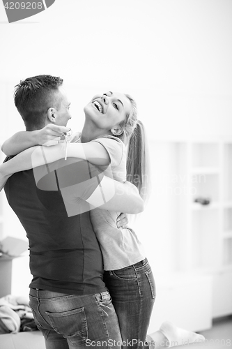 Image of happy Young couple moving in new house