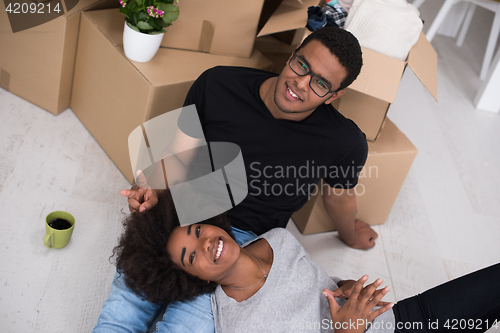 Image of African American couple relaxing in new house