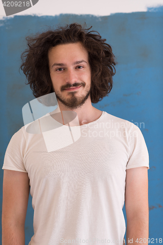 Image of young man with funny hair over color background