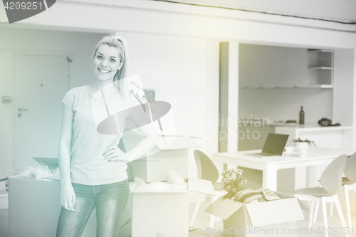 Image of girl moving in the new apartment