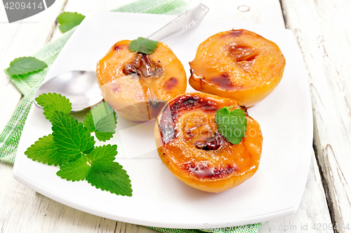 Image of Quince baked with mint in plate on light board