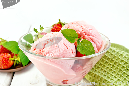 Image of Ice cream strawberry in glass on light board