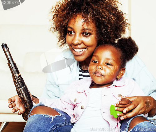 Image of adorable sweet young afro-american mother with cute little daugh