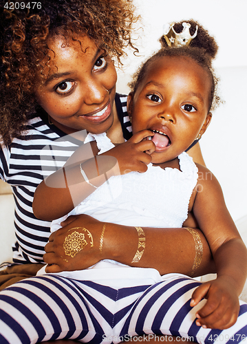 Image of adorable sweet young afro-american mother with cute little daugh