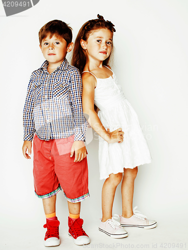 Image of little cute boy and girl hugging playing on white background, ha