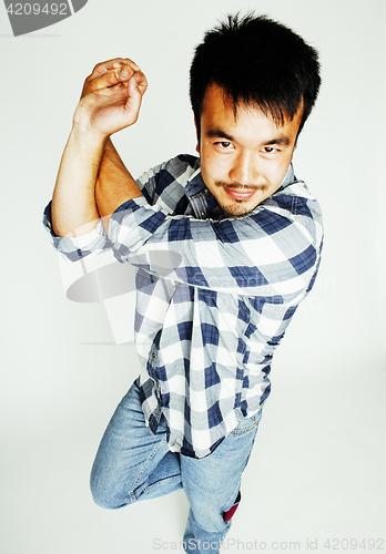 Image of young cute asian man on white background gesturing emotional, po