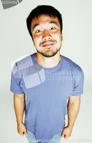 Image of young cute asian man on white background gesturing emotional, po