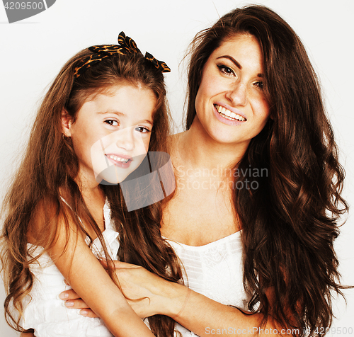 Image of young mother with little cute daughter emotional posing on white