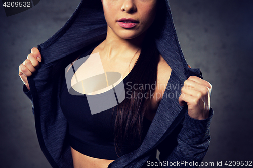 Image of close up of woman posing and showing sportswear