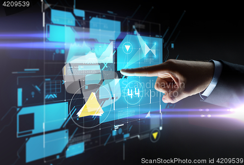 Image of close up of hand pointing finger to virtual screen