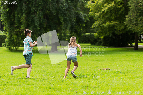 Image of group of happy kids or friends playing outdoors