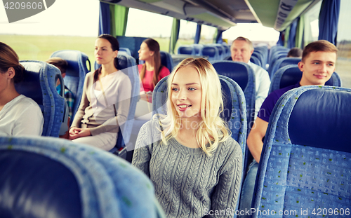 Image of group of passengers or tourists in travel bus