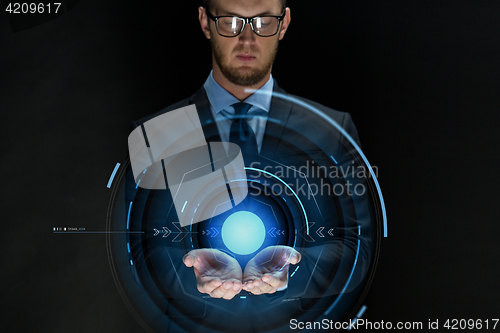Image of businessman with virtual projection over black