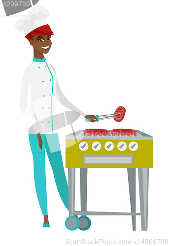 Image of Chef cook cooking steak on barbecue grill.