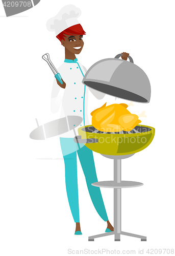 Image of Chef cook cooking chicken on barbecue grill.