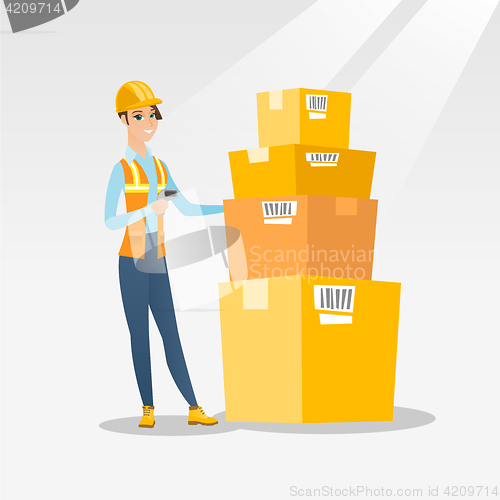 Image of Warehouse worker scanning barcode on box.