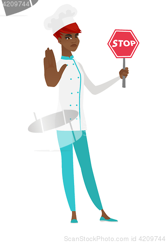 Image of African-american chef cook holding stop road sign.