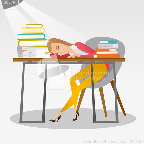 Image of Female student sleeping at the desk with book.