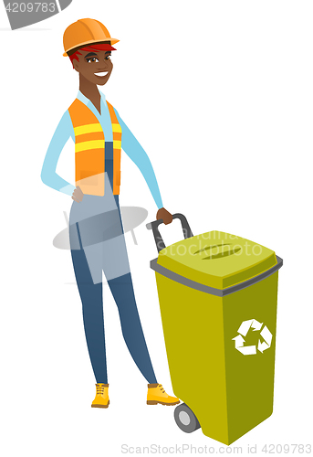 Image of African-american builder pushing recycle bin.