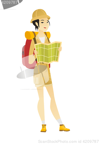 Image of Traveler with backpack looking at map.