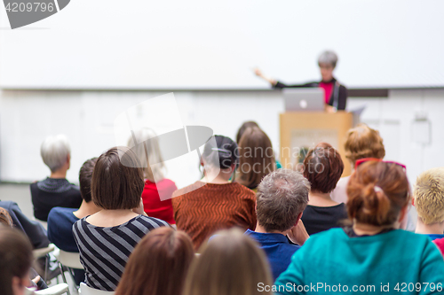 Image of Woman giving presentation on business conference.
