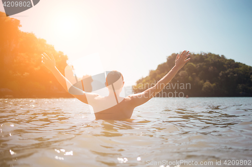 Image of Guy in sea during day