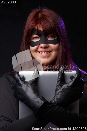 Image of Beautiful hacker in black gloves