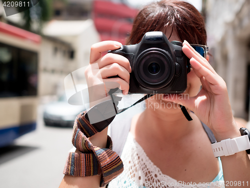 Image of Girl with camera near face