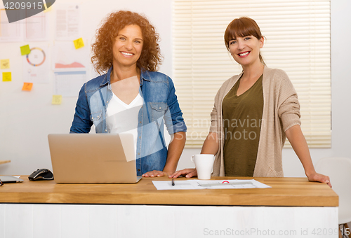 Image of Two businesswoman working together