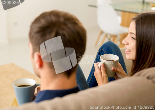 Image of Young couple drinking coffee