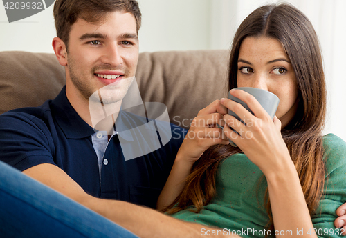 Image of Young couple drinking coffee