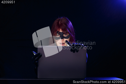 Image of Night photo of female hacker