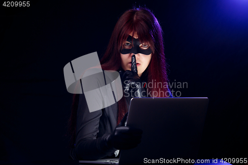 Image of Hacker with finger at mouth