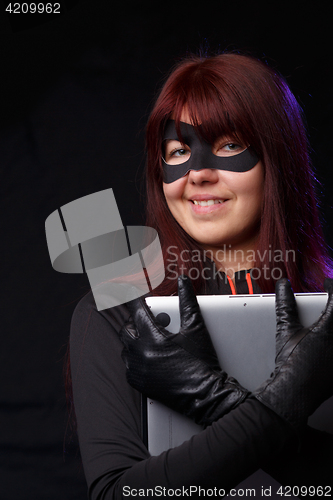 Image of Laughing hacker in black gloves