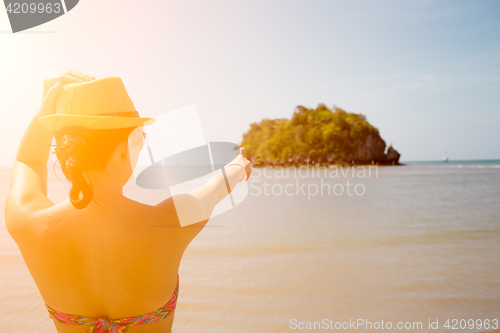 Image of Girl in hat on sea