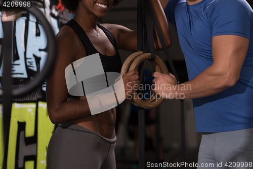 Image of Portrait of multiethnic couple  after workout at gym