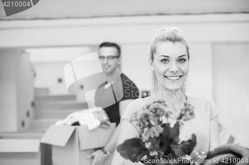 Image of young couple moving into a new home